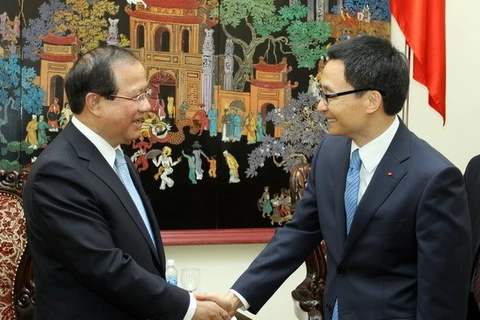Deputy Prime Minister Vu Duc Dam receives Information, Culture Minister Bosengkham Vongdara (Source: VNA)