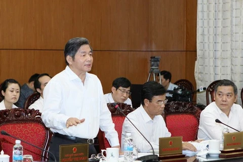 Minister of Planning and Investment Bui Quang Vinh speaks at the session (Photo: VNA)