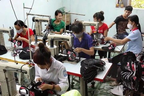 Garment workers (Photo: VNA)