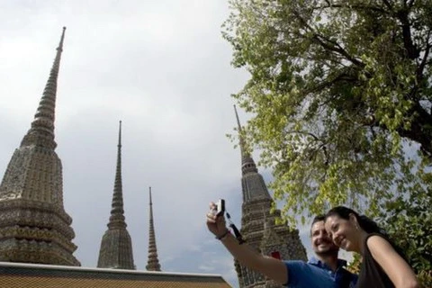 Tourists at Wat Pho Temple in Bangkok, Thailand (Photo: AP)