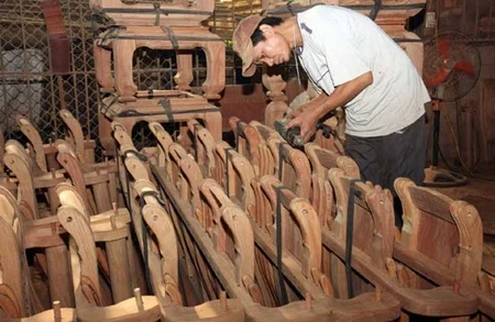 Wooden products are prepared for export at Son Dong company in Ha Noi's Thuong Tin district. Local firms will face increased competition in the AEC market.(Photo: VNA/VNS)