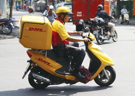 DHL-VNPT, which holds the second largest domestic market share, has invested US$10 million to further expand its market, including the purchase of modern equipment and the opening of more delivery centres in large cities. (Photo: Vnpost)