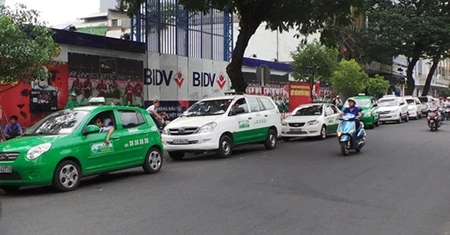 The HCM City Taxi Association, members of which have been hit by the expansion of Uber services, asked for an urgent solution to the new competitor. — Bizlive