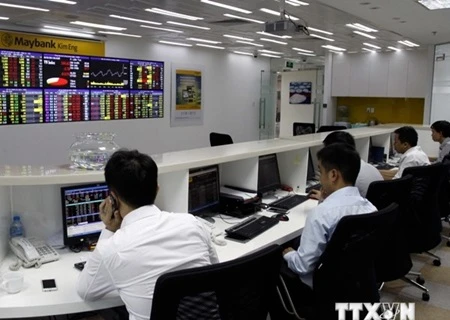 Most of the companies listed on the Hanoi Stock Exchange report positive results (Photo: VNA)