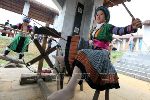 Every young Mong ethnic girl is good at sewing their traditional colourful costumes. (Photo: VNA)