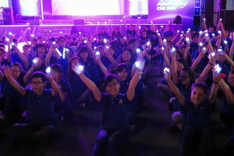Volunteers at the Earth Hour event in HCM City in 2014 (Photo: VNA)