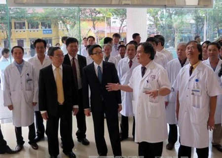Deputy Prime Minister Vu Duc Dam, senior Party and Government officials, and delegates from the World Health Organisation, World Bank and the European Union attended (Photo: VNA)