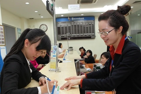 Customer service provided at a Sacombank branch. (Photo: VNA)