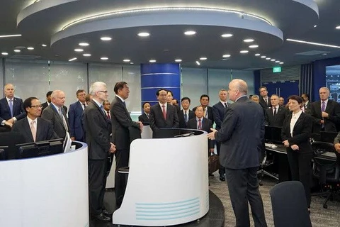 Defence Minister Tran Dai Quang visited the Interpol Global Complex for Innovation (IGCI) in Singapore. (Source: VNA)