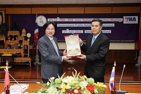 VNA Deputy Director General Ngo Ha Thai and PRD Deputy Director General Charoon Chaisorn at the JTC meeting (Source: VNA)