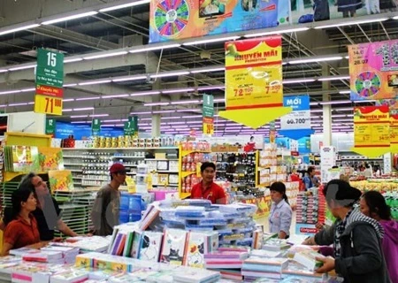 Co.opMart and Co.opXtra supermarkets nationwide are offering discounts of 20 per cent to 33 per cent on 300 items, including student uniforms, school bags, notebooks, pens and other school supplies until August 9. (Photo: VNA)