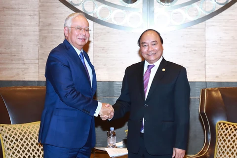 Premieres de Vietnam y Malasia intercambian temas de interés común 