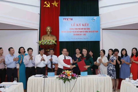 VNA y Unión de Mujeres de Vietnam firman acuerdo de cooperación 
