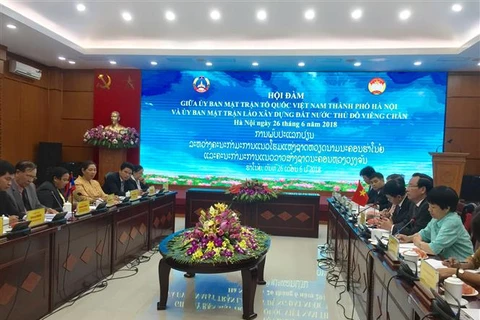 Fomentan cooperación entre organizaciones de masas de capitales de Vietnam y Laos