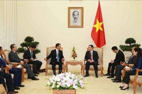 El viceprimer ministro de Vietnam Vuong Dinh Hue y el subsecretario del Comité del Partido Comunista de China en la provincia de Yunnan, Wang Yobo