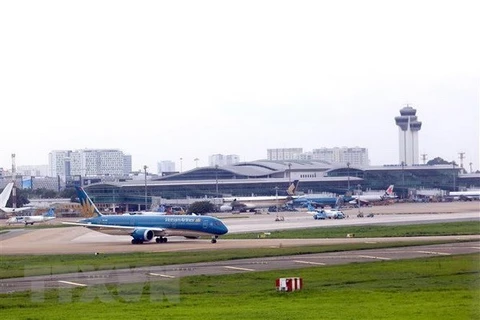 Regresan trabajadores destacados a casas para celebrar el Tet en vuelos de Vietnam Airlines