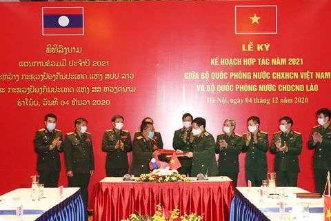 Ministerios de Defensa de Vietnam y Laos firman plan de cooperación para 2021
