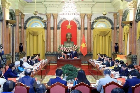 Resaltan coordinación entre Presidente y Frente de Patria de Vietnam para desarrollo nacional
