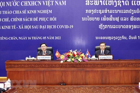 Vietnam y Laos intercambian experiencias en recuperación posCOVID-19