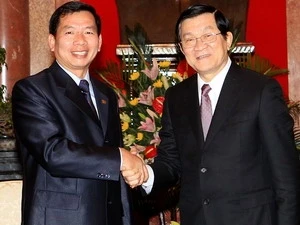 El presidente vietnamita, Truong Tan Sang, recibe al titular laosiano del Tribunal Supremo Popular, Khamphanh Sithidampha, (Fuente:VNA)