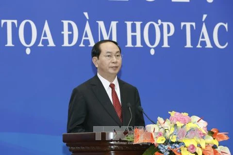 Tran Dai Quang au colloque de coopération économique et commerciale Vietnam-Chine