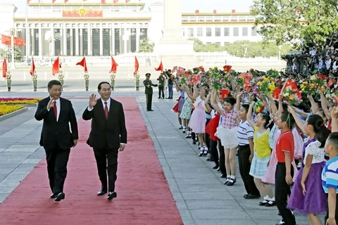 Le président vietnamien Trân Dai Quang (droite) et le secrétaire général du Parti communiste chinois et président chinois Xi Jinping, le 11 mai à Pékin. 