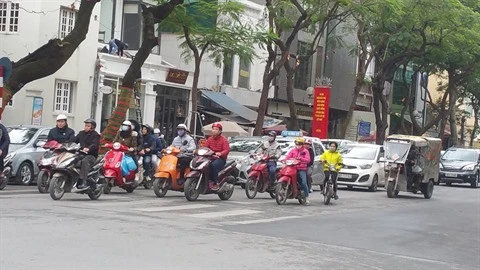 La plupart des Vietnamiens respectent le port du casque de moto