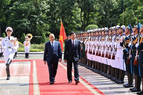 Cérémonie d’accueil du SG du Parti et président du Laos en visite d’amitié officielle au Vietnam