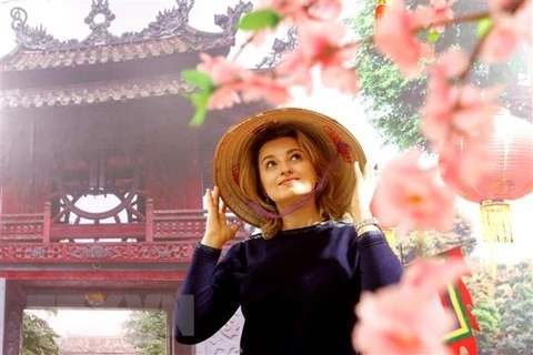 Une photographe russe impressionnée par l’ao dai du Vietnam