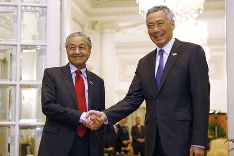 ​La Malaisie cherche à établir un partenariat compétitif avec Singapour