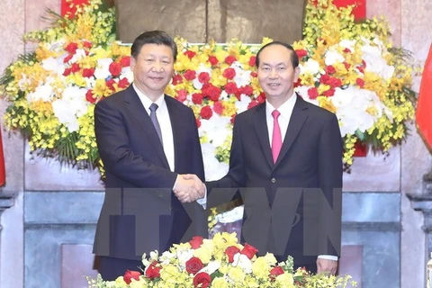 Entretien entre les présidents Tran Dai Quang et Xi Jinping