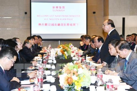 Le PM participe à un échange de vue avec les groupes chinois