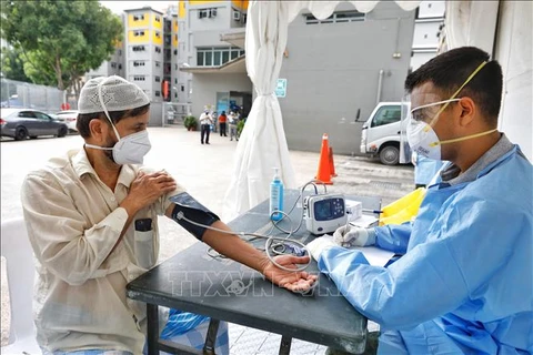 Singapour signale deux citoyens vietnamiens contaminés au COVID-19