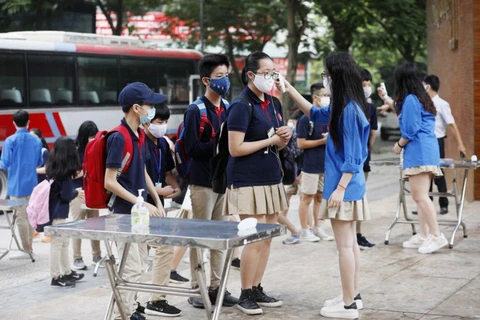 Les médias internationaux rapportent le retour à l'école au Vietnam
