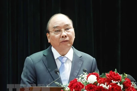 Le président Nguyên Xuân Phuc souligne le rôle du travail sur la population