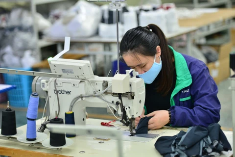 La production d'équipements de protection individuelle au Vietnam a été multipliée par six en 2020