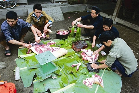 Abattage de porcs la veille du Nouvel An. (Photo:VNA)