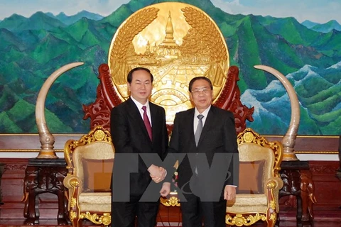 Le secrétaire général du PPRL et président du Laos, Chummaly Saynhasone, reçoit le ministre vietnamien de la Sécurité publique Tran Dai Quang. Photo: VNA