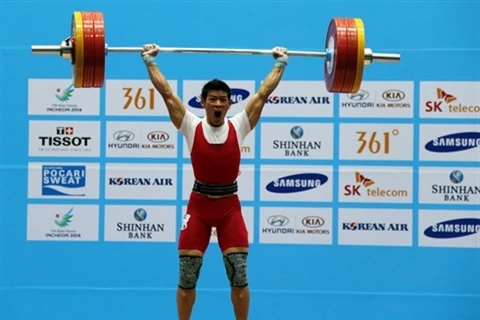 Thach Kim Tuân, le plus grand espoir de l’haltérophilie vietnamienne pour les prochains Jeux olympiques d’été, en 2016, à Rio de Janeiro (Brésil). Photo : VNA