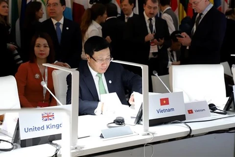 Заместитель премьер-министра и министр иностранных дел Фам Бинь Минь на конференции. (Фото: Фам Тханг / ВИА)