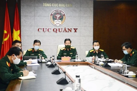 Вьетнамские офицеры принимают участие в телеконференции (Источник: qdnd.vn)
