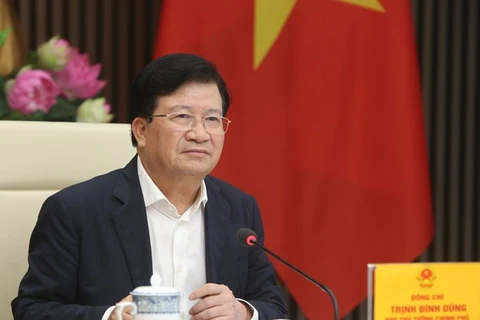 Заместитель премьер-министра Чинь Динь Зунг председательствует на заседании. (Фото: ВИА)