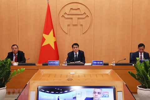 Председатель Народного комитета Ханоя Нгуен Дык Тьюнг также принял участие из столицы Вьетнама - Ханоя. (Фото: Лам Кхань/ВИА)