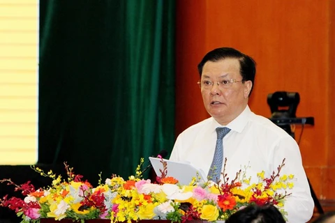 Министр финансов Динь Тьен Зунг выступает на конференции в Ханое 7 июля (Фото: ВИА)