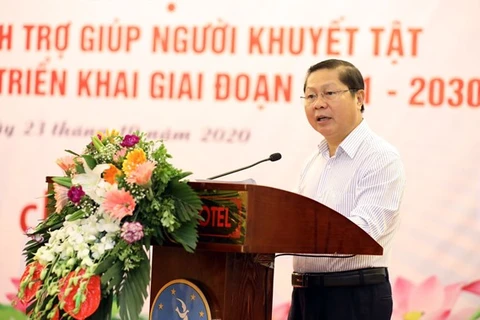 Заместитель министра труда, инвалидов и социальных дел Ле Тан Зунг выступает на конференции (Фото: ВИА)