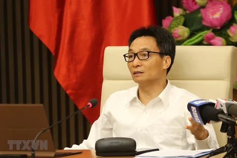 Заместитель премьер-министра Ву Дык Дам на встрече (Фото: ВИА)