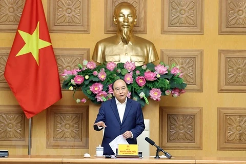 Премьер-министр Нгуен Суан Фук выступает на встрече. (Фото: ВИА)