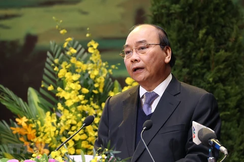 Премьер-министр Нгуен Суан Фук принял участие и на съезде выступил от имени партийных и государственных руководителей. (Фото: ВИА)