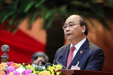 Член Политбюро, премьер-министр Нгуен Суан Фук выступает с приветственной речью на XIII всевьетнамском съезде КПВ 26 января (Фото: ВИА)
