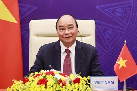 Президент Нгуен Суан Фук на церемонии открытия онлайн-саммита по климату 22 апреля (Фото: ВИА)